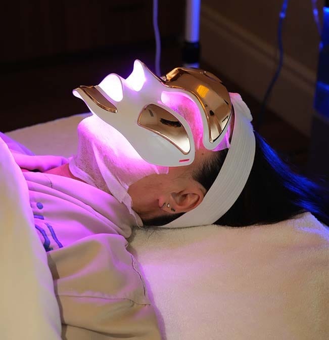 Guest receiving LED facial therapy at ila Only Spa Midtown Manhattan NYC