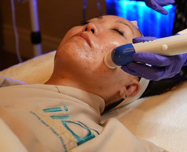 Guest receiving advanced LED facial treatment at ila Only Spa Midtown Manhattan NYC