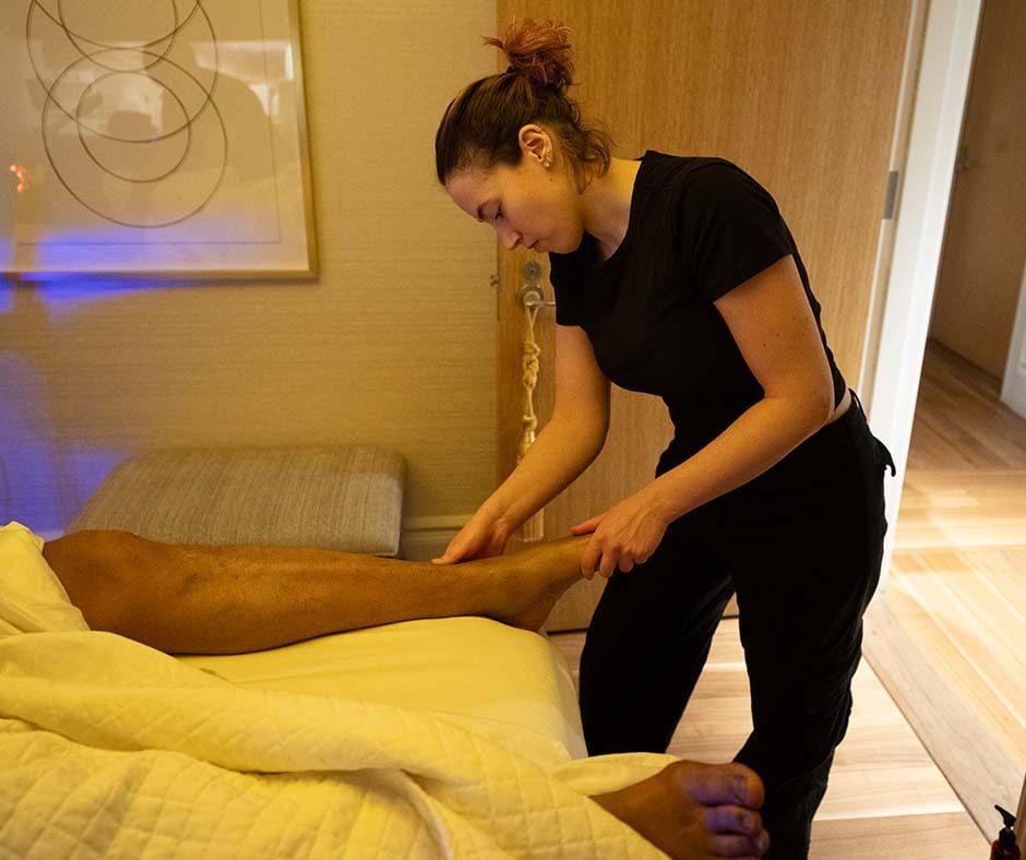 Massage therapist performing a professional foot massage at ila Only Spa in New York City