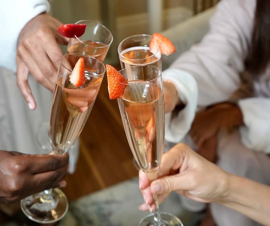 Friends raising glasses during a bachelorette spa celebration at ila Only Spa in NYC