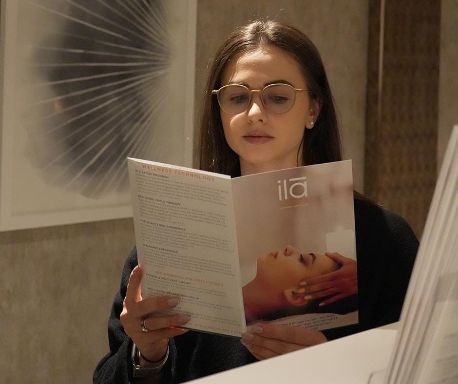 Guest reviewing ila Only Spa treatments while planning a bachelorette spa day in New York City