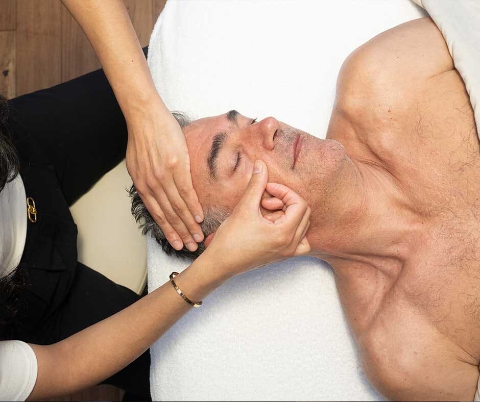 Client receiving a head and neck massage at ila Only Spa in NYC