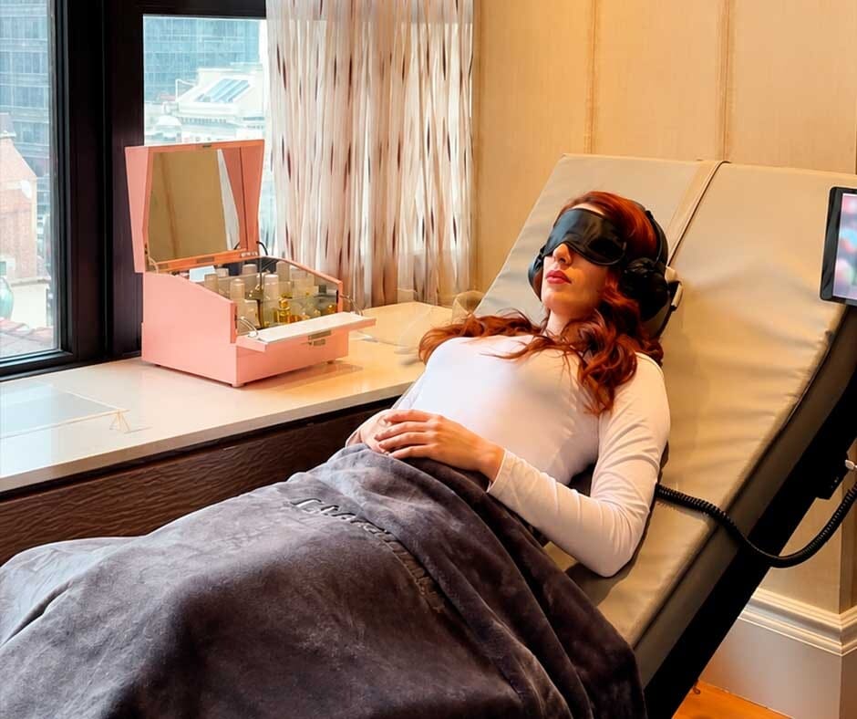 Guest relaxing with the RLX Aurasens sensory wellness experience at ila Only Spa in NYC