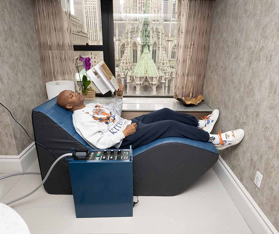 Guest relaxing with wellness technology at ila Only Spa in Midtown Manhattan